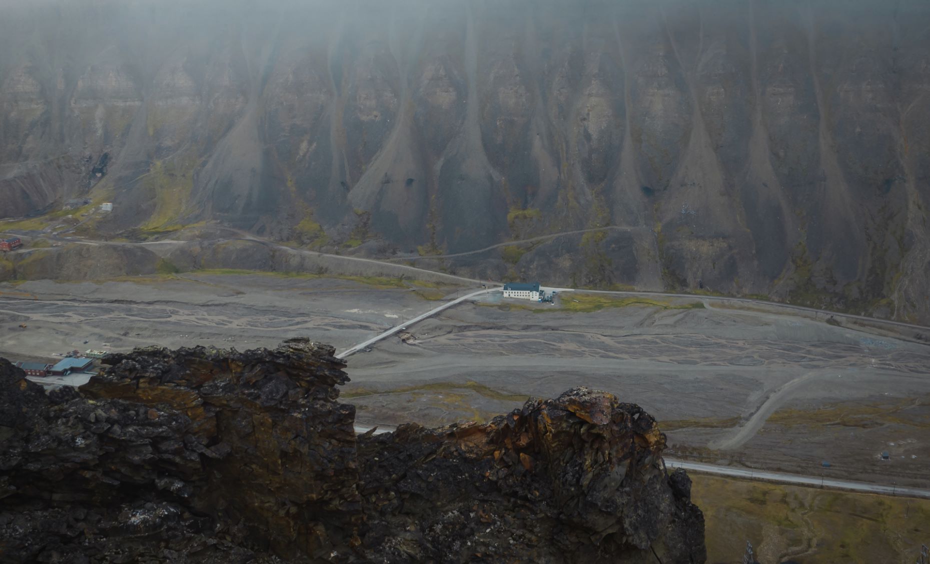 The building "Huset" seen from the outside from the top of a nearby mountain