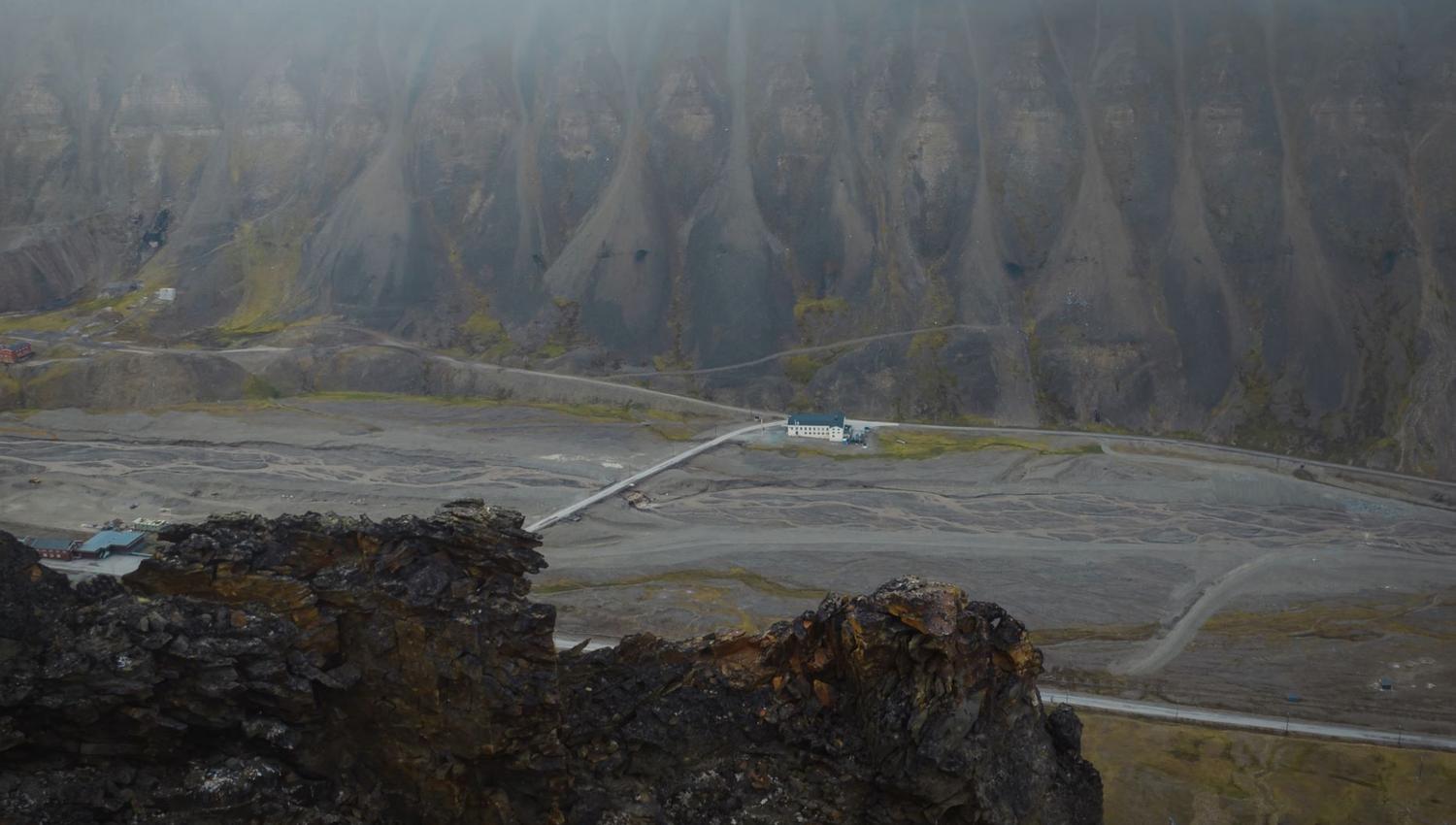 The building "Huset" seen from the outside from the top of a nearby mountain