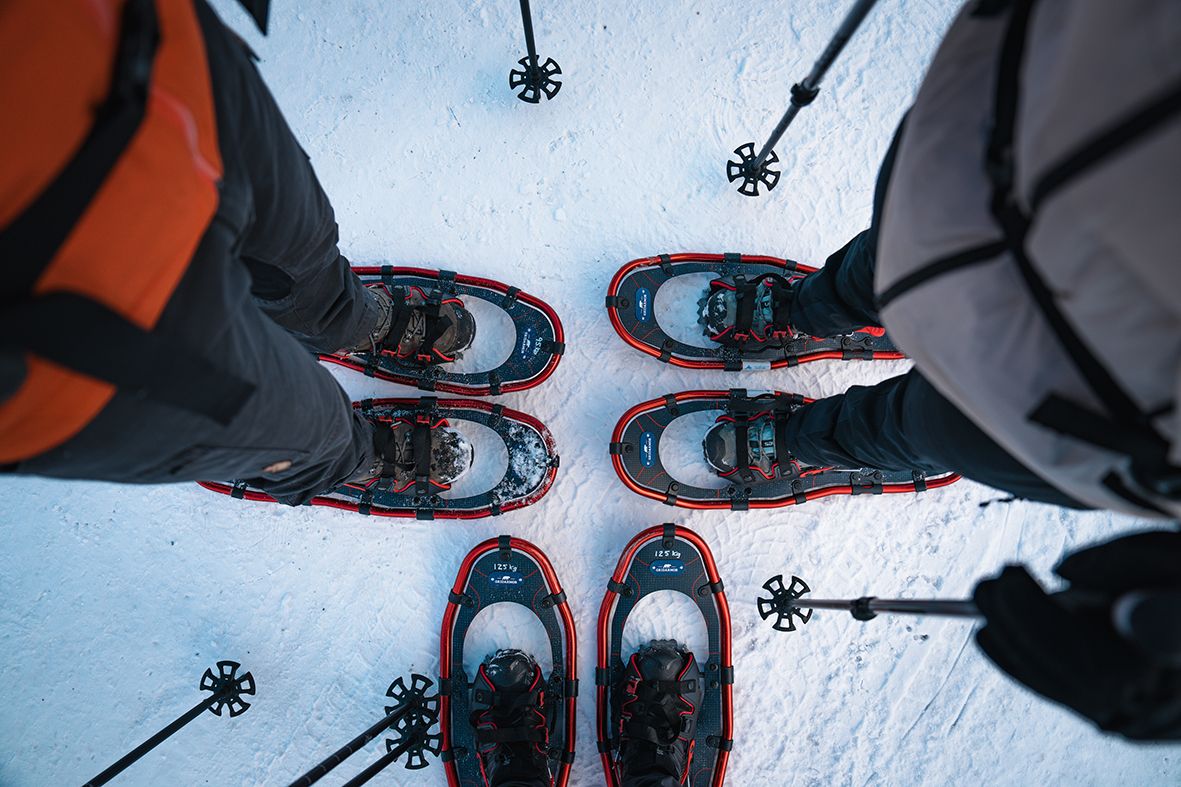Close-up of snowshoes in the snow – ready for winter adventures.
