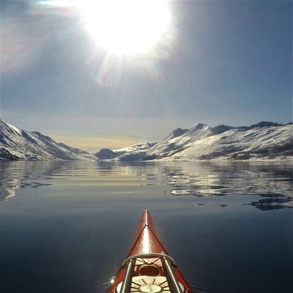 View over snow covered mountains from a kayak