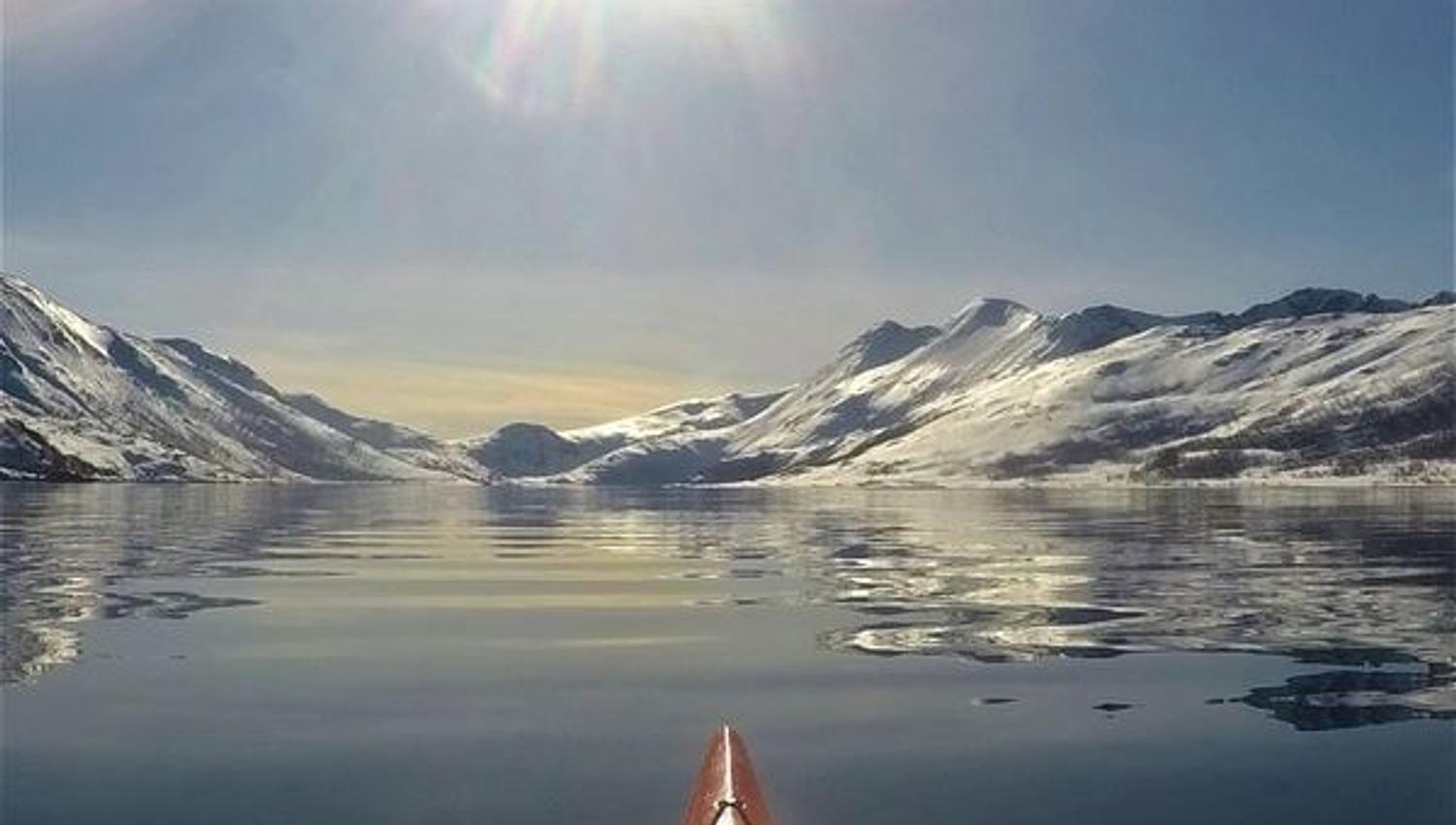 View over snow covered mountains from a kayak
