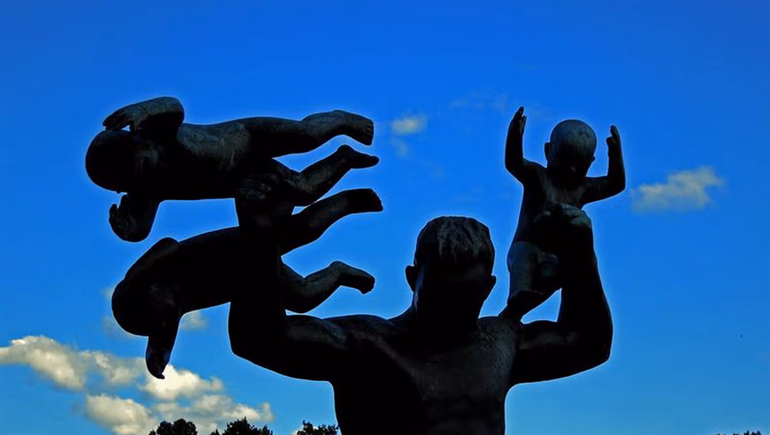 statue of an adult man with three babies