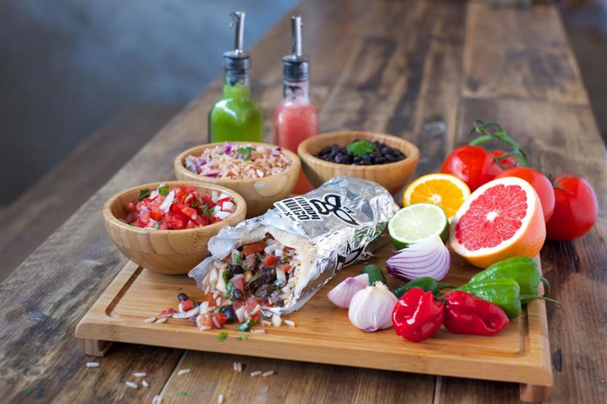 Detail picture of various foods, vegetables and fruits on a wooden pole.