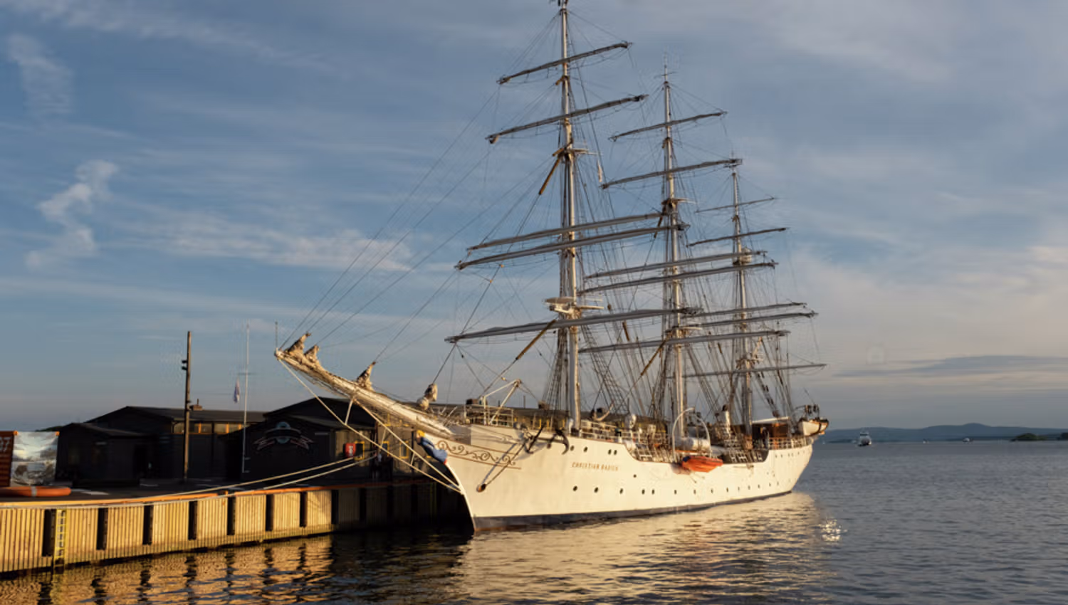 The ship ankered by the pier.