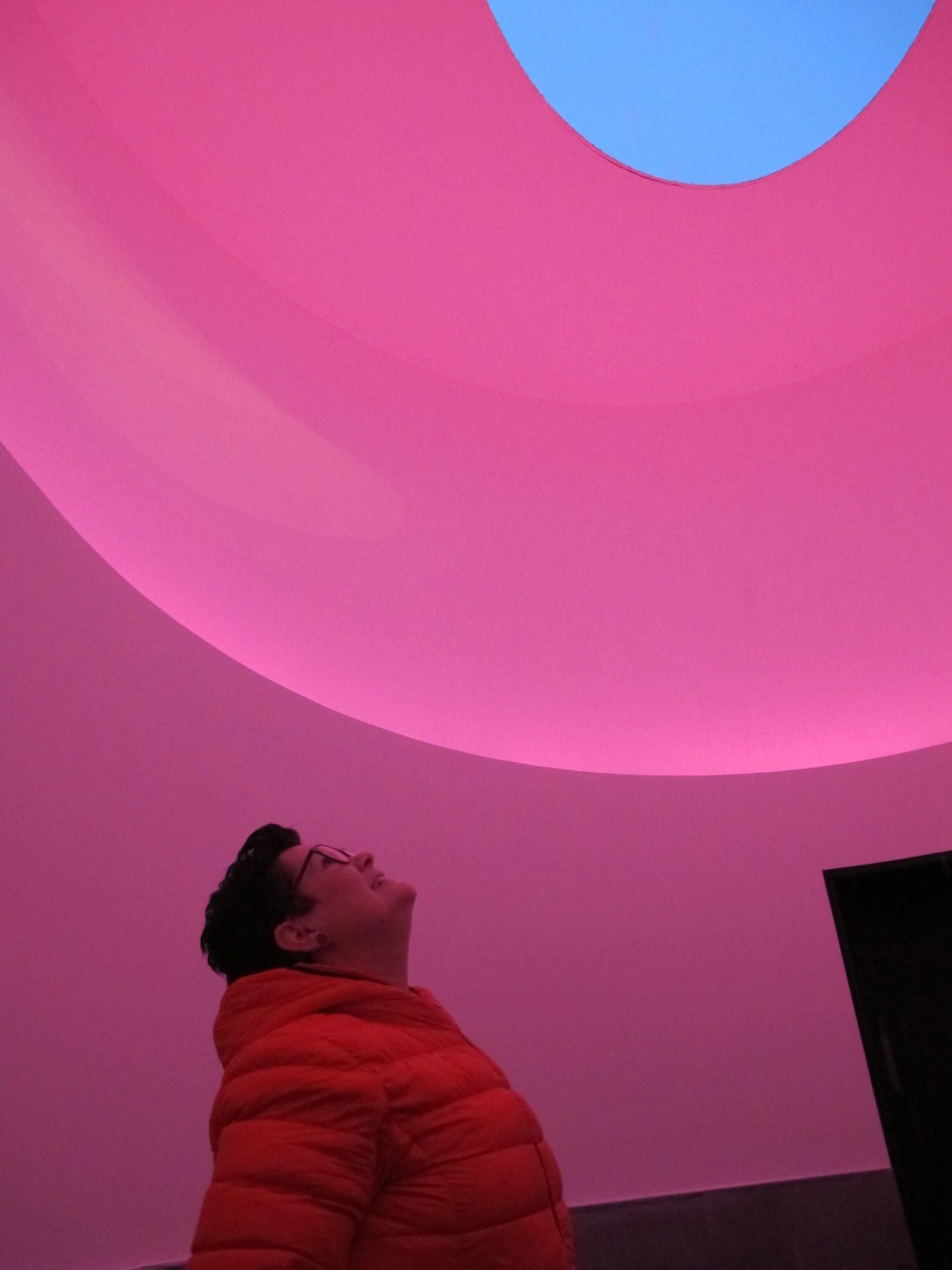 Visitor experiencing a unique light installation inside Hardanger Skyspace.