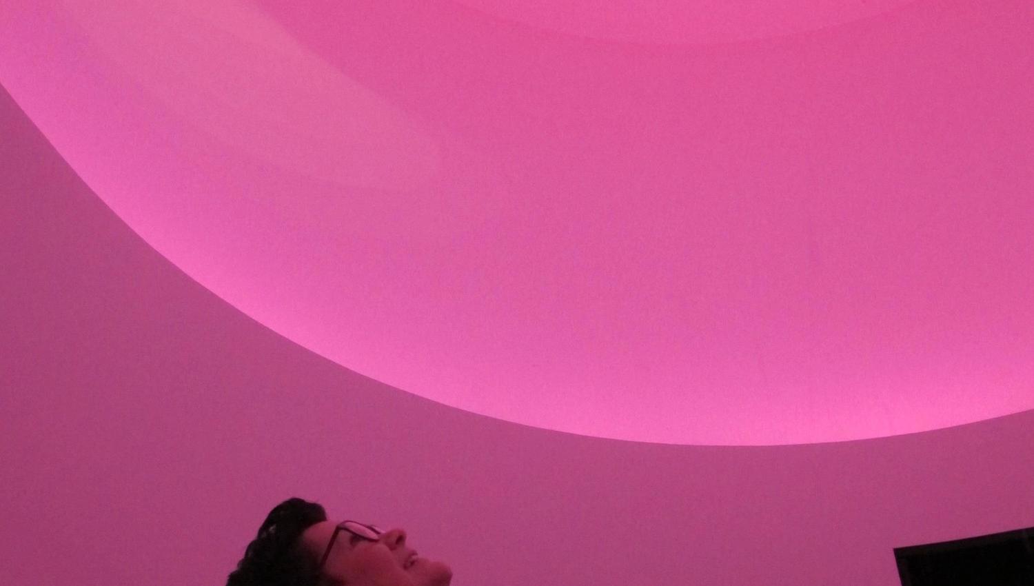 Visitor experiencing a unique light installation inside Hardanger Skyspace.