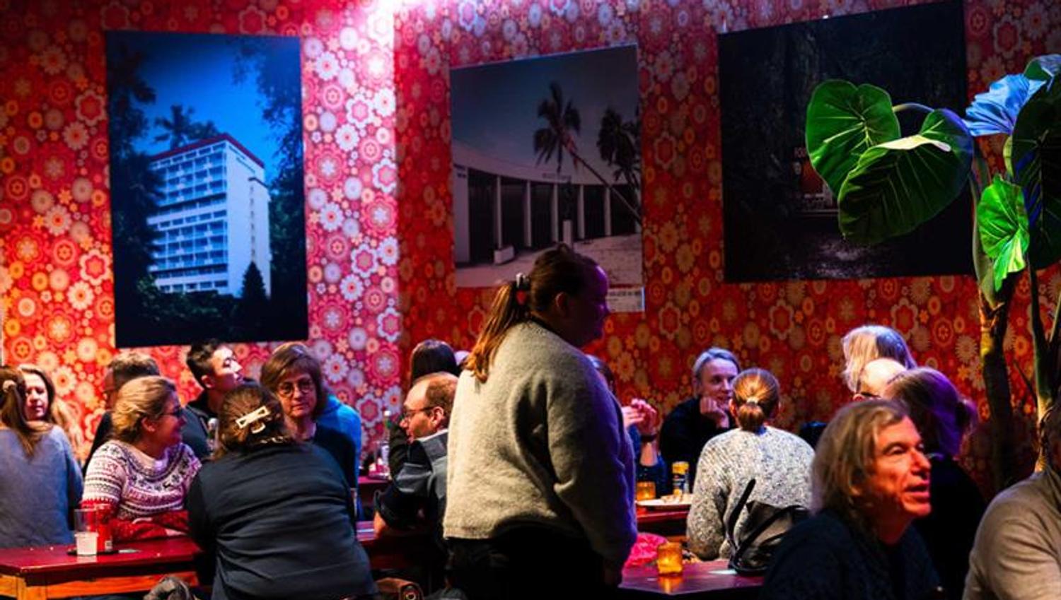 People sitting at the long tables