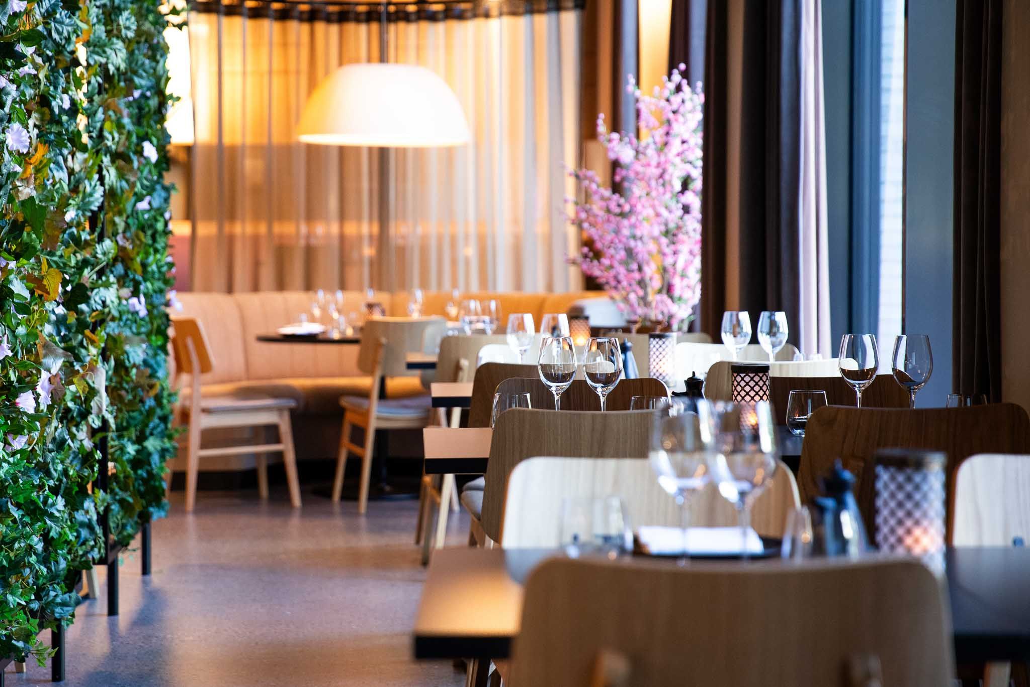 Restaurant interior of tables set for dining and chairs