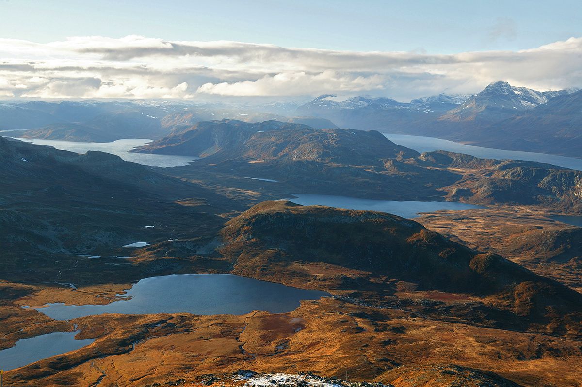 View from the summit to many lakes and lower and higher mountains.