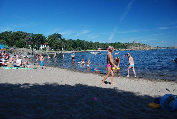 People relaxing along the beach