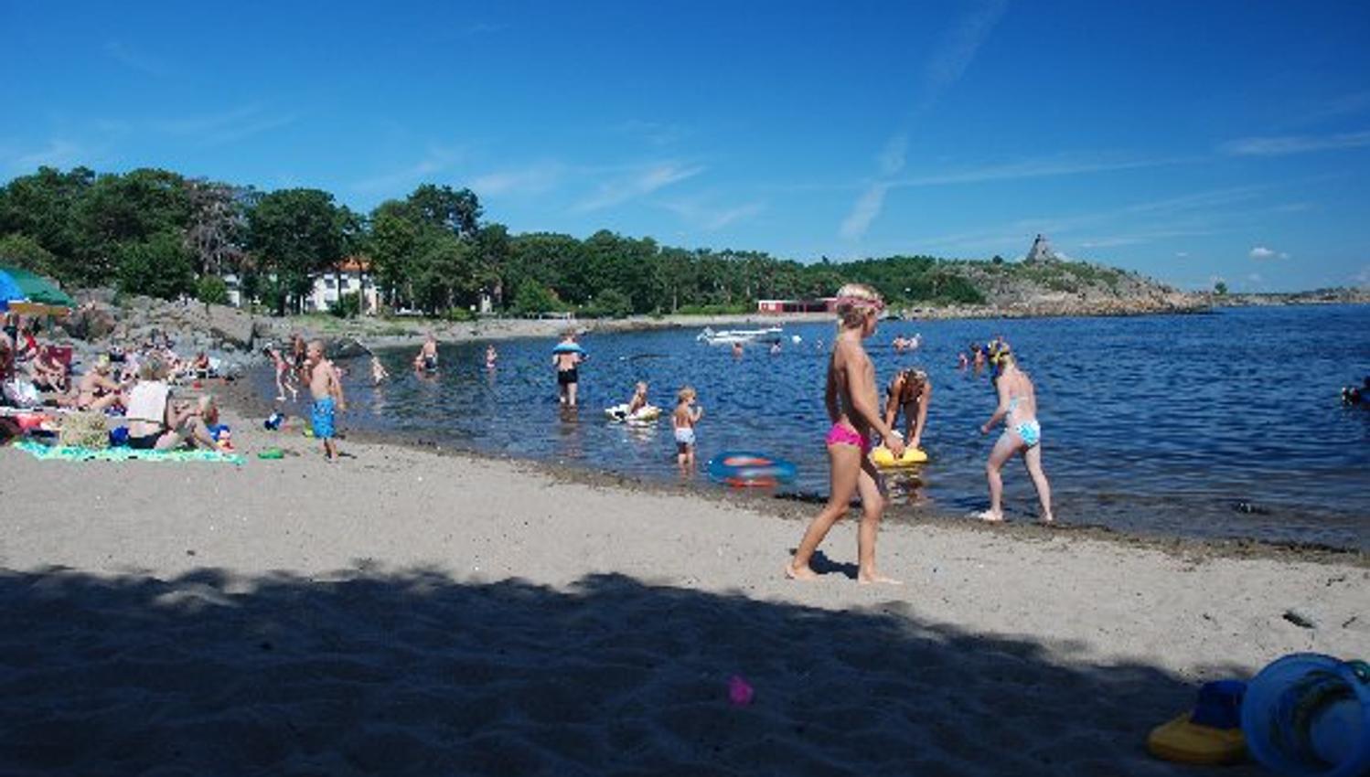 People relaxing along the beach