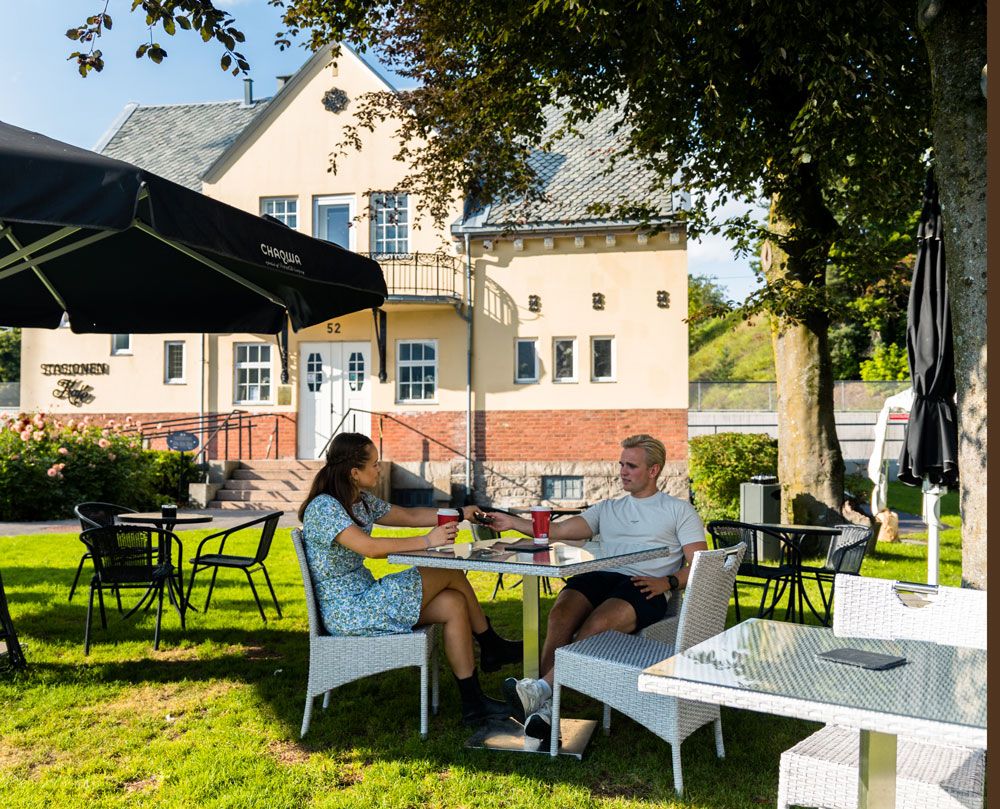 couple sitting in the garden at the Station cafe