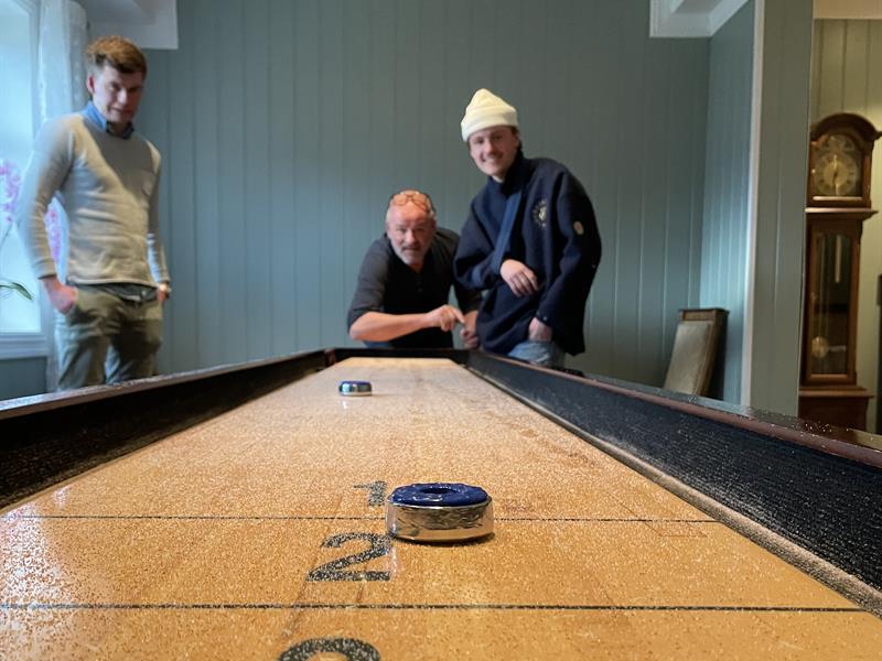 Men playing shuffle board
