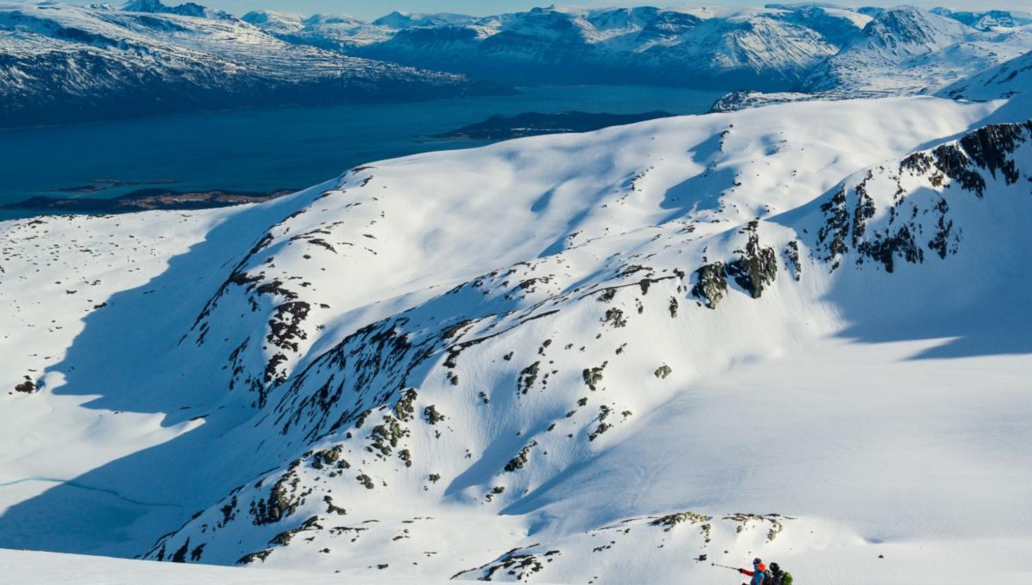 Two persons skiing in the mountain
