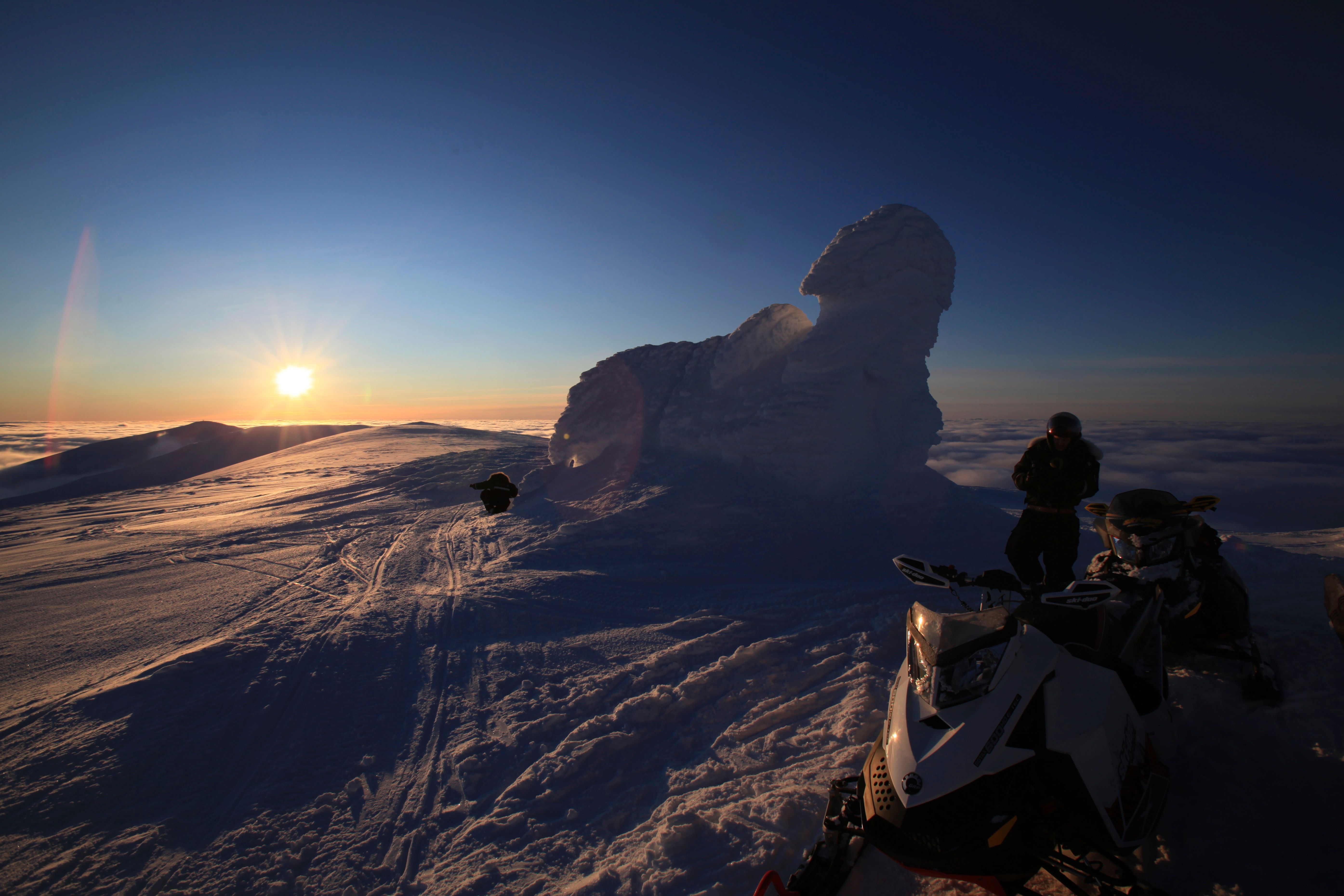 Midnightsun seen from the snowcovered summit 
