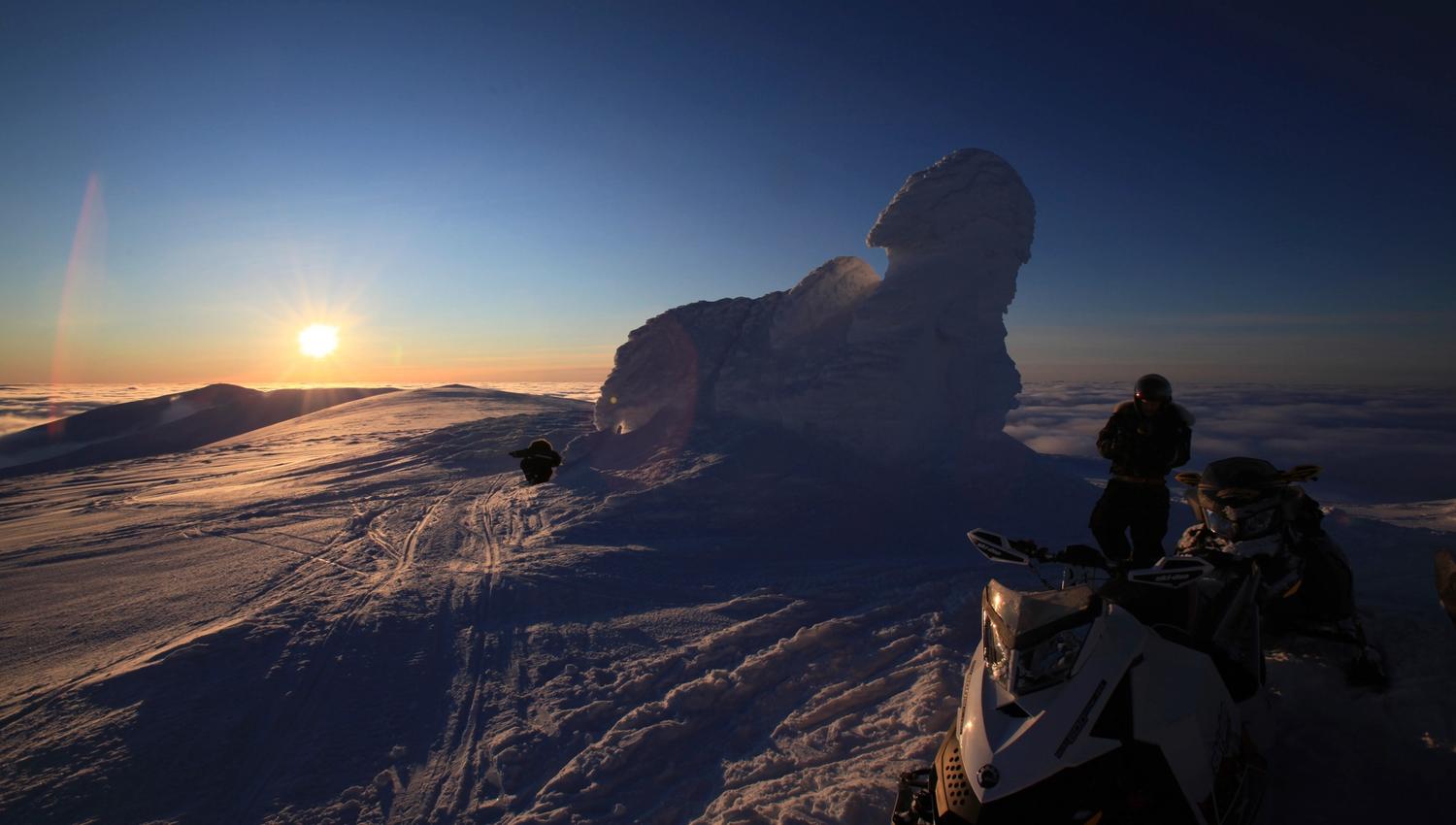 Midnightsun seen from the snowcovered summit