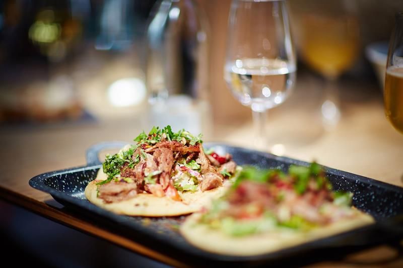 Detail photo of two tacos on a tray.