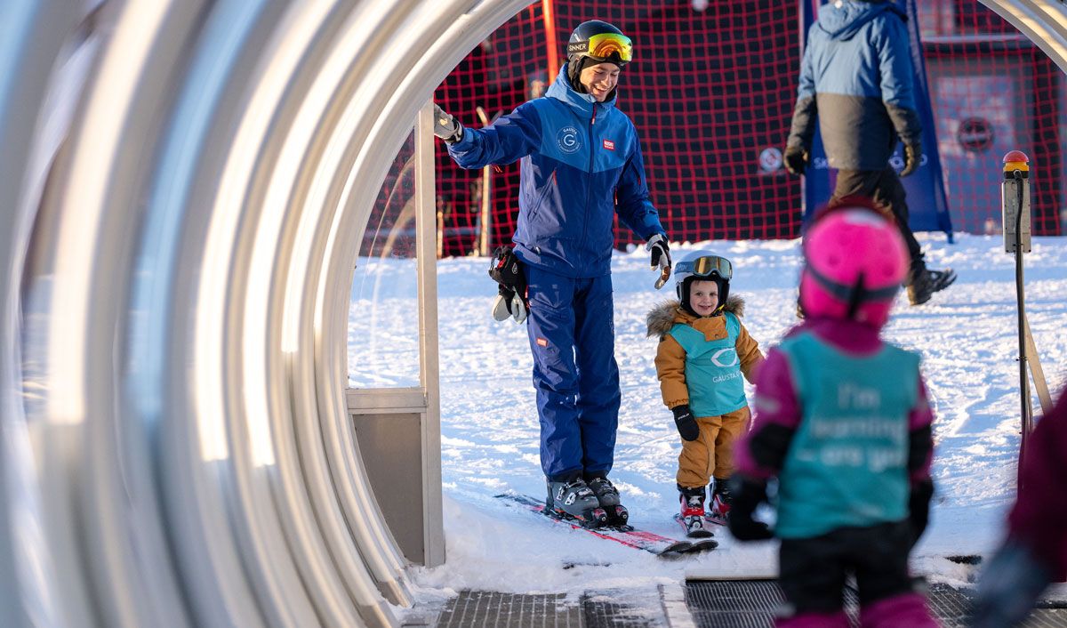 mother with child in the ski lift at Gausta ski center