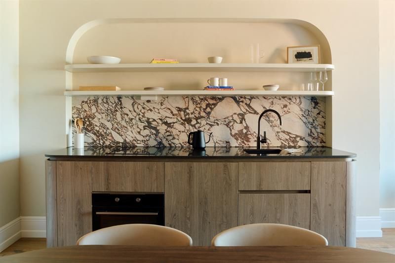 The kitchen is fully equipped with integrated appliances and ample counter space. Suitable for self-catering and extended stays.