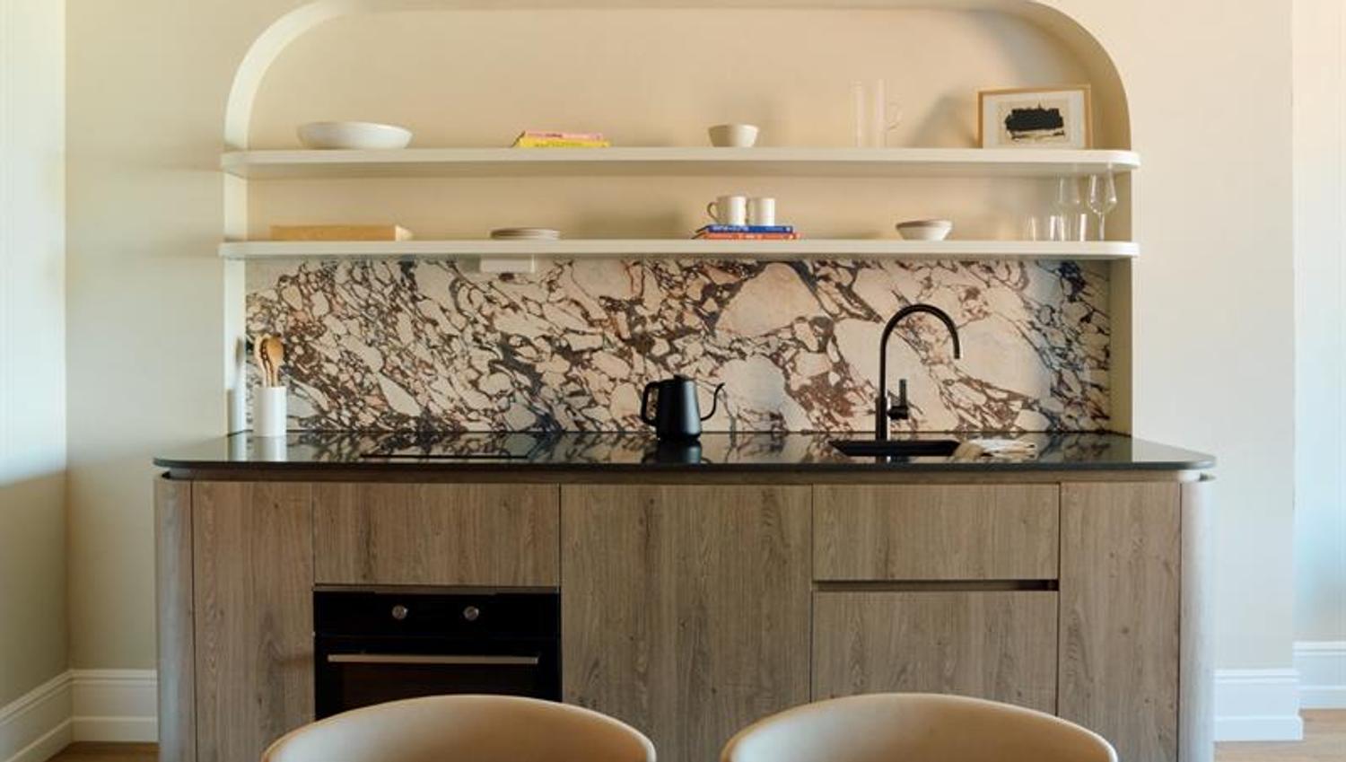 The kitchen is fully equipped with integrated appliances and ample counter space. Suitable for self-catering and extended stays.