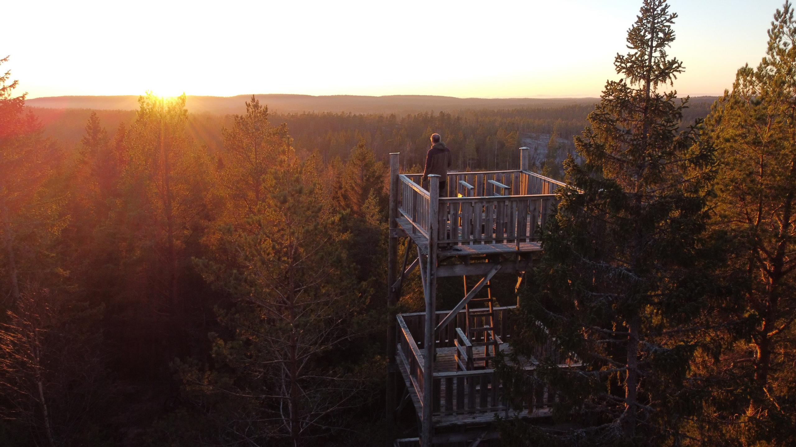 A visitor standing on the top of the tower