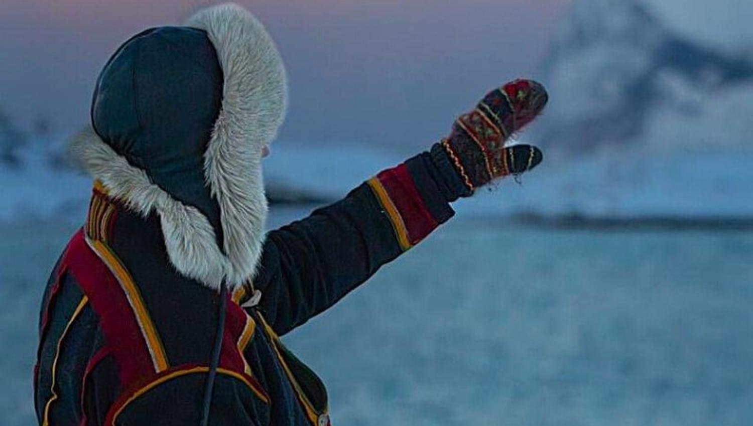 Sami Guide shows the way dressed in a traditional "koft"