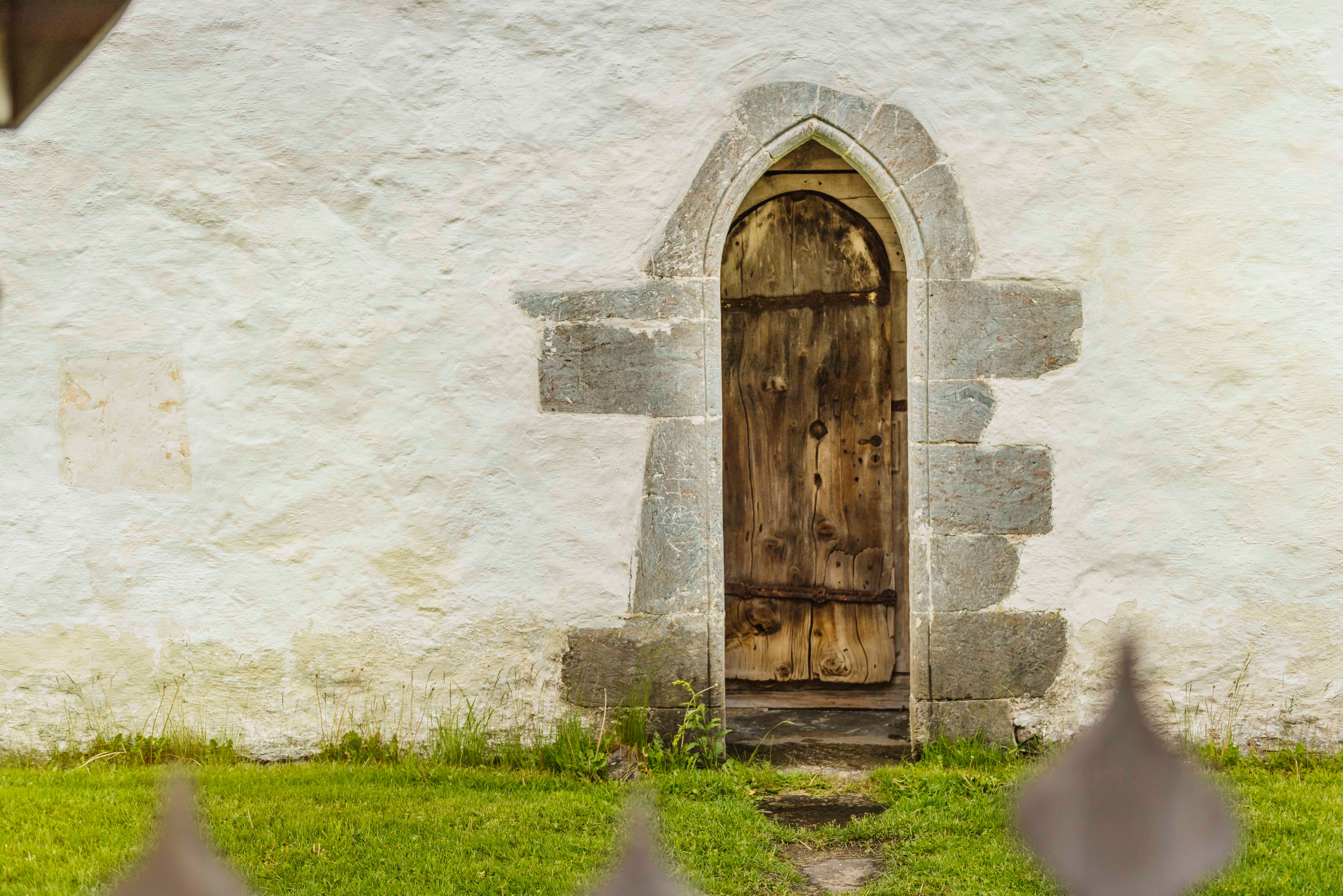 An old wooden side door to the church.
