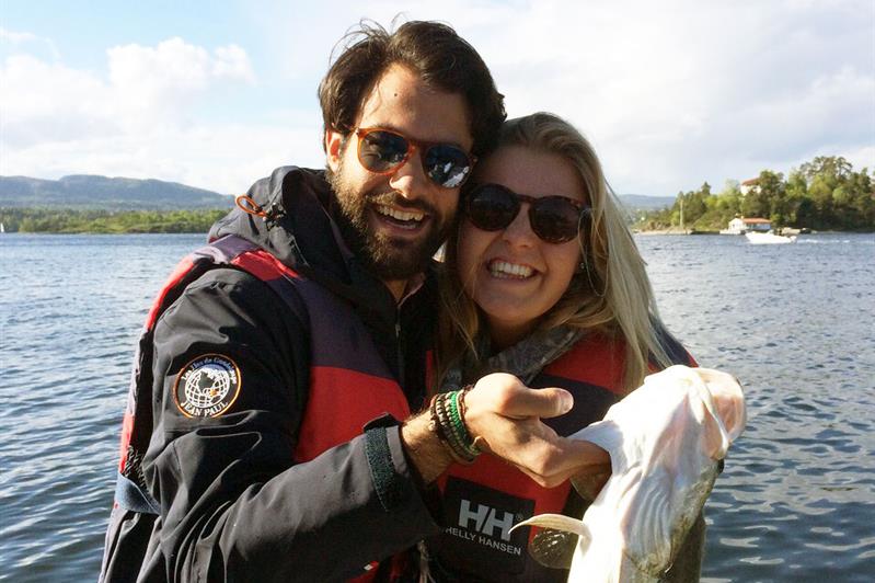 a couple with a fish in the hand