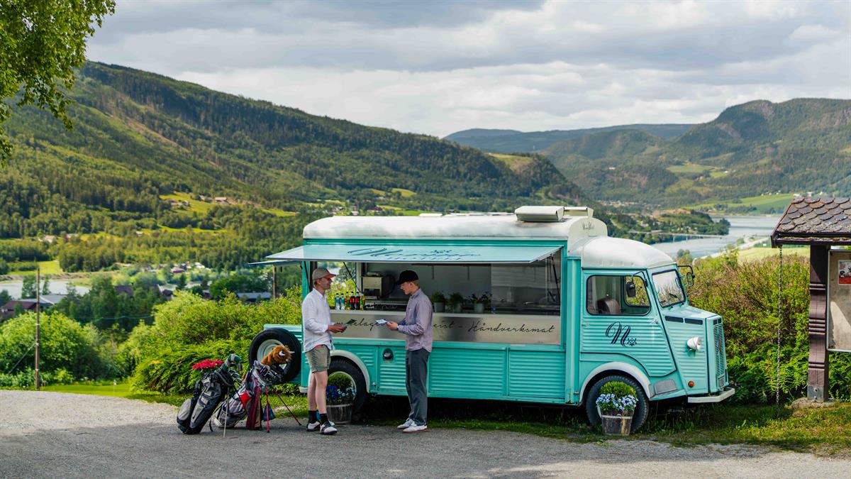 Food truck overlooking the golf course and mountains.
