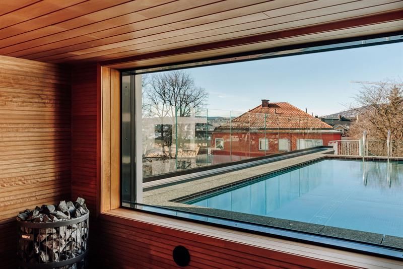 Sauna with an outdoor pool outside