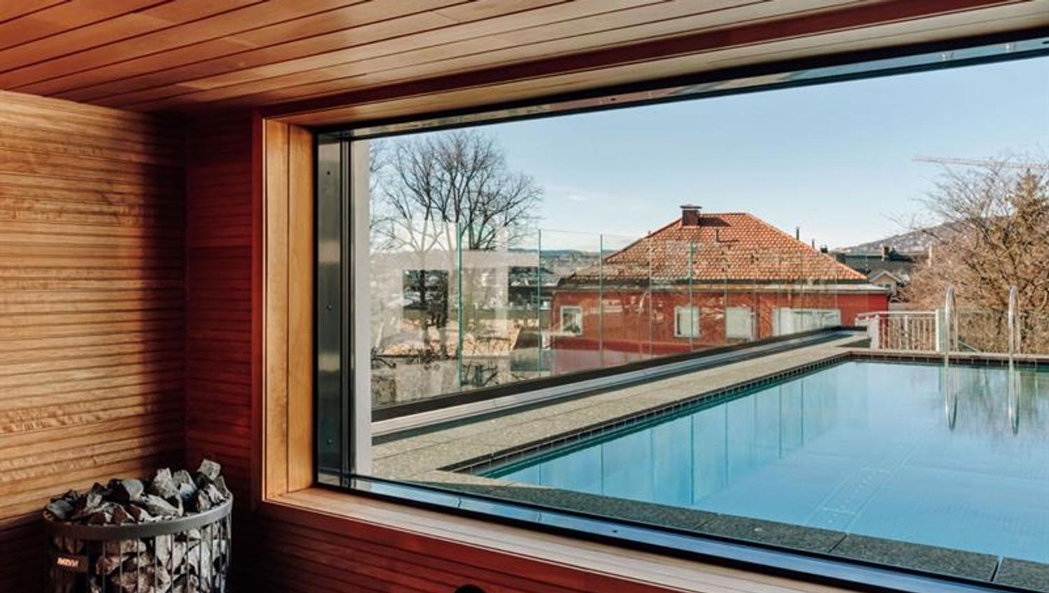 Sauna with an outdoor pool outside