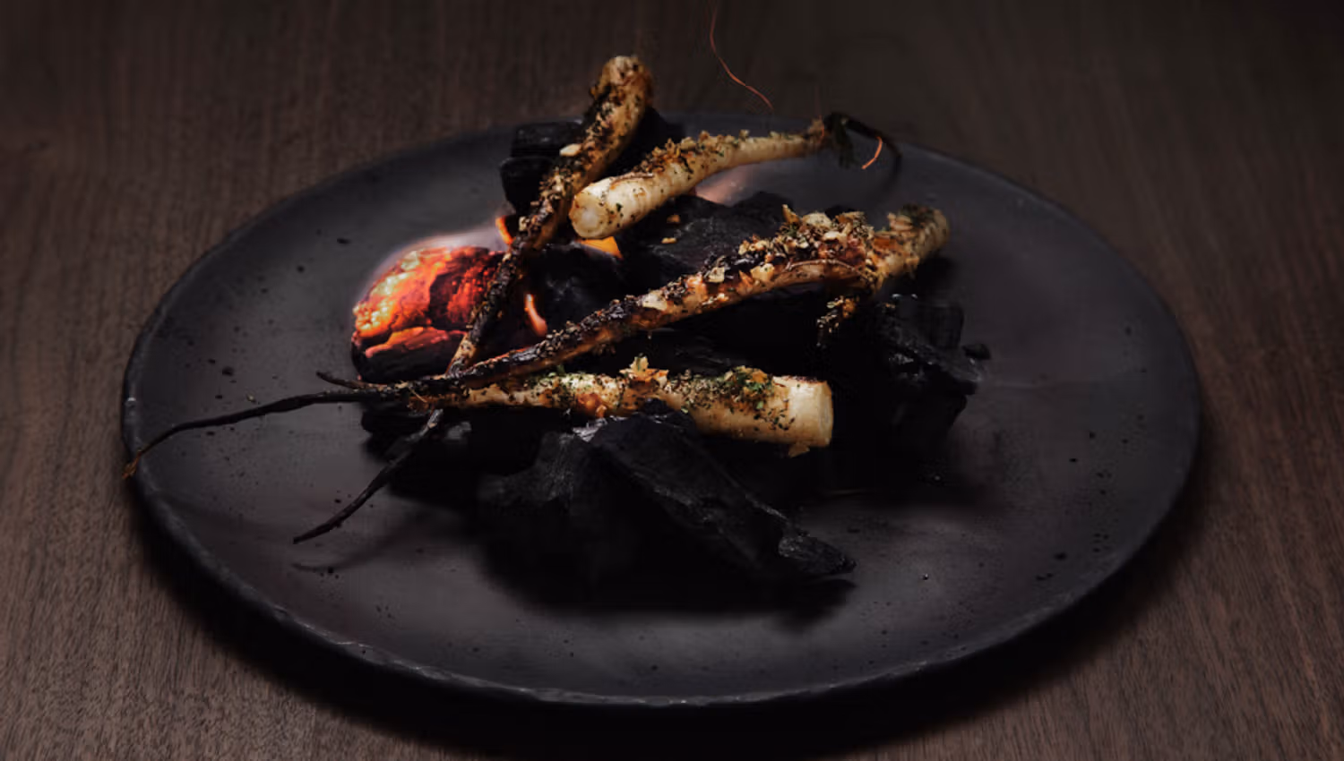 Detail photo of a dish on a black plate.
