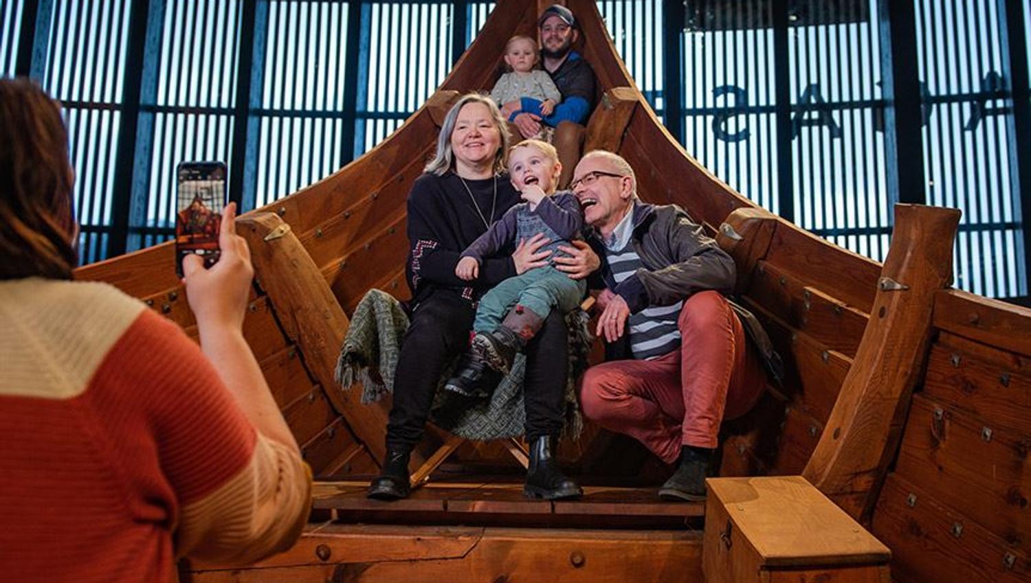 Multiple generations experiencing the Myklebust Ship together inside Sagastad Viking Center.