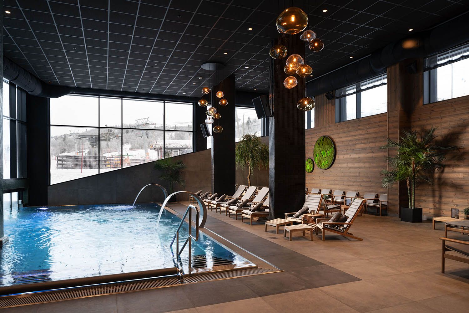 Indoor swimming pool with relaxing chairs