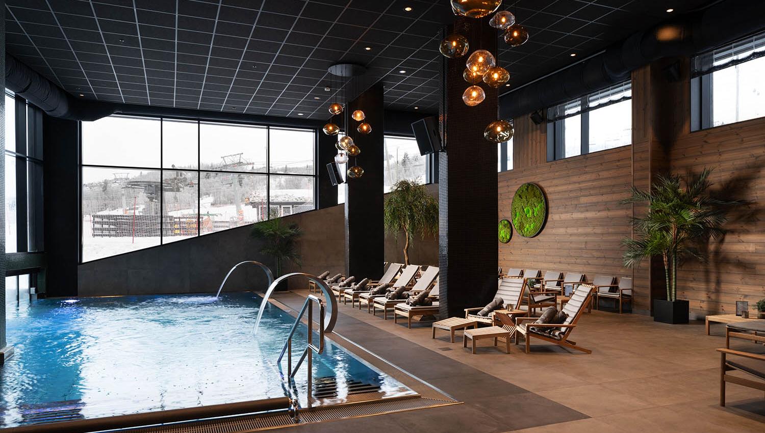 Indoor swimming pool with relaxing chairs