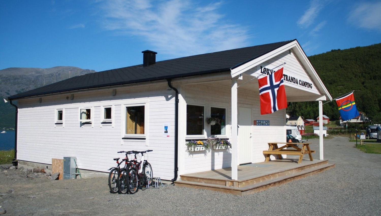 A white reception building at the camping