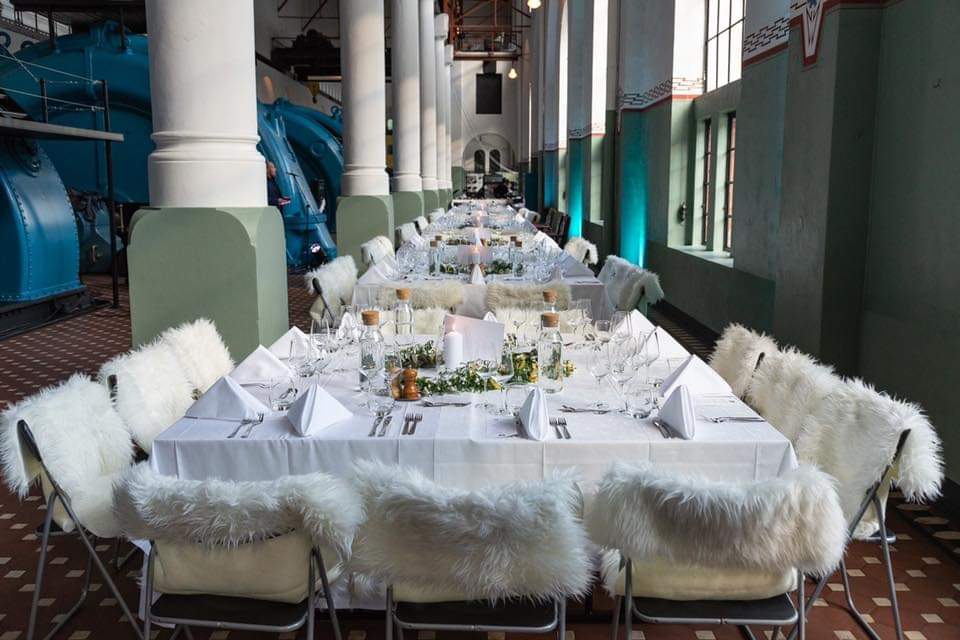 A table set for dinner inside a hydropower station. 
