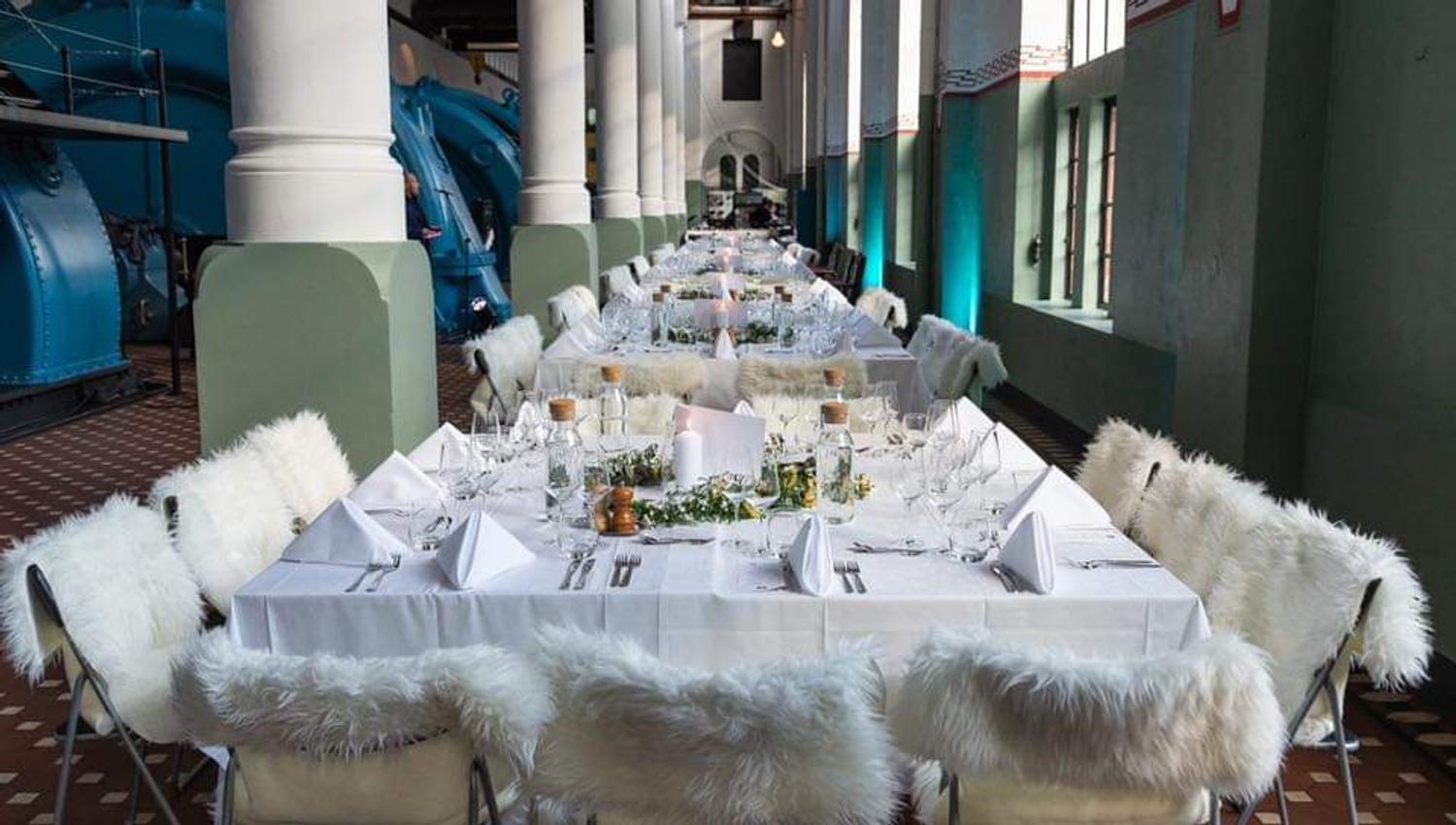 A table set for dinner inside a hydropower station.