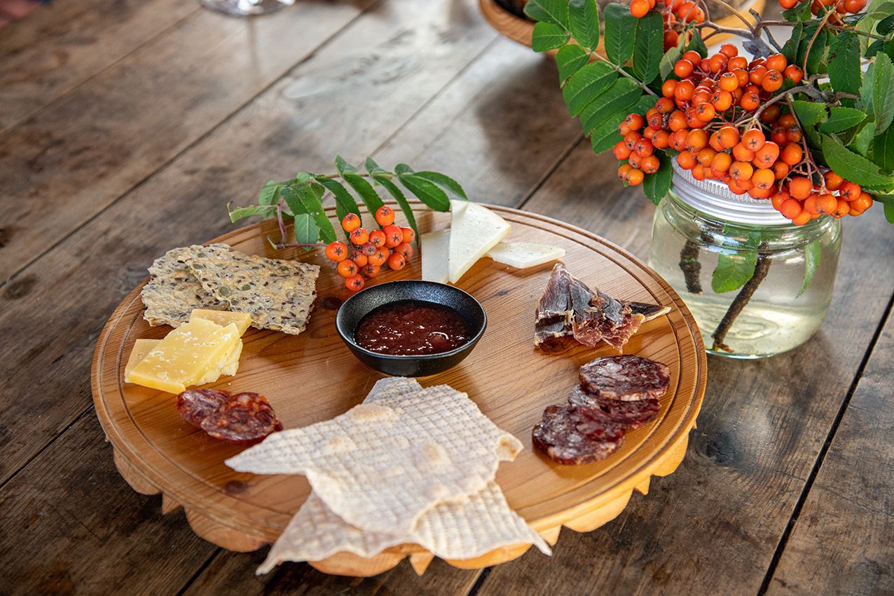 Platter of local cheese, cured meat and flatbread at Eldhuset Farm Restaurant in Hardanger.