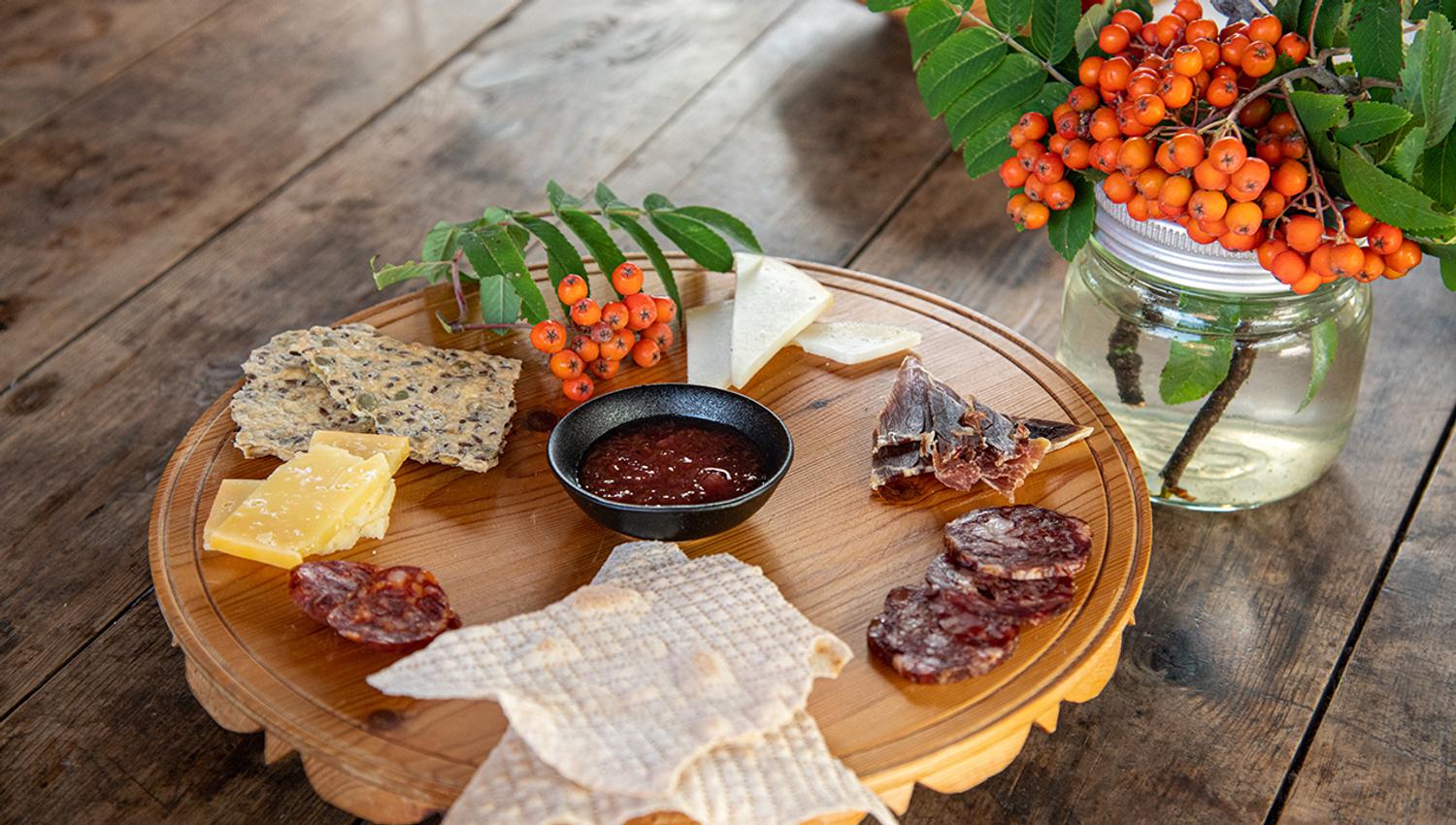 Platter of local cheese, cured meat and flatbread at Eldhuset Farm Restaurant in Hardanger.