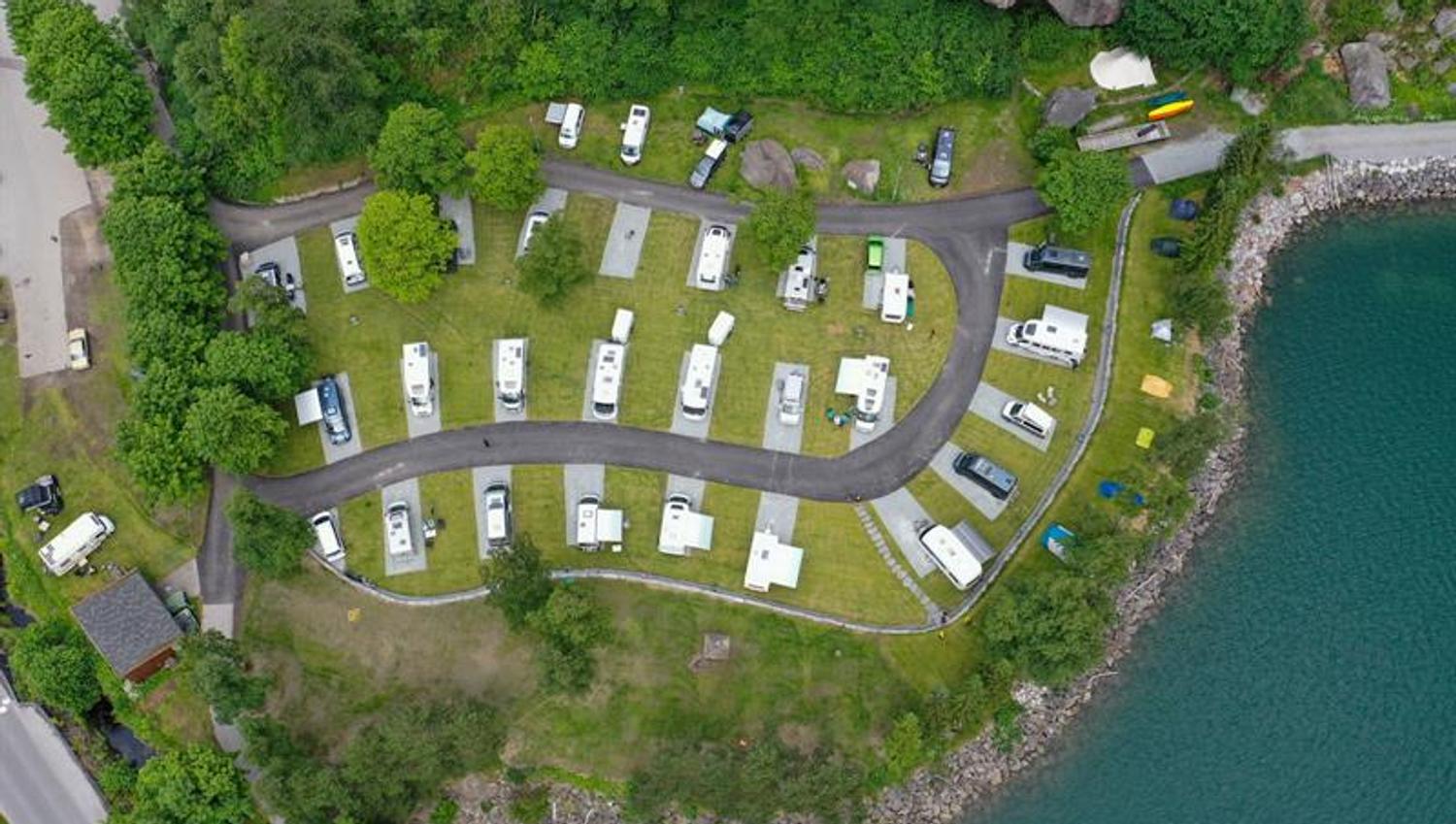 Aerial view of Trolltunga Camping with motorhome pitches along the fjord.