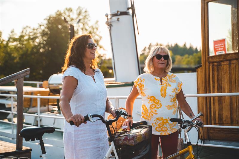 Two women with their bikes 