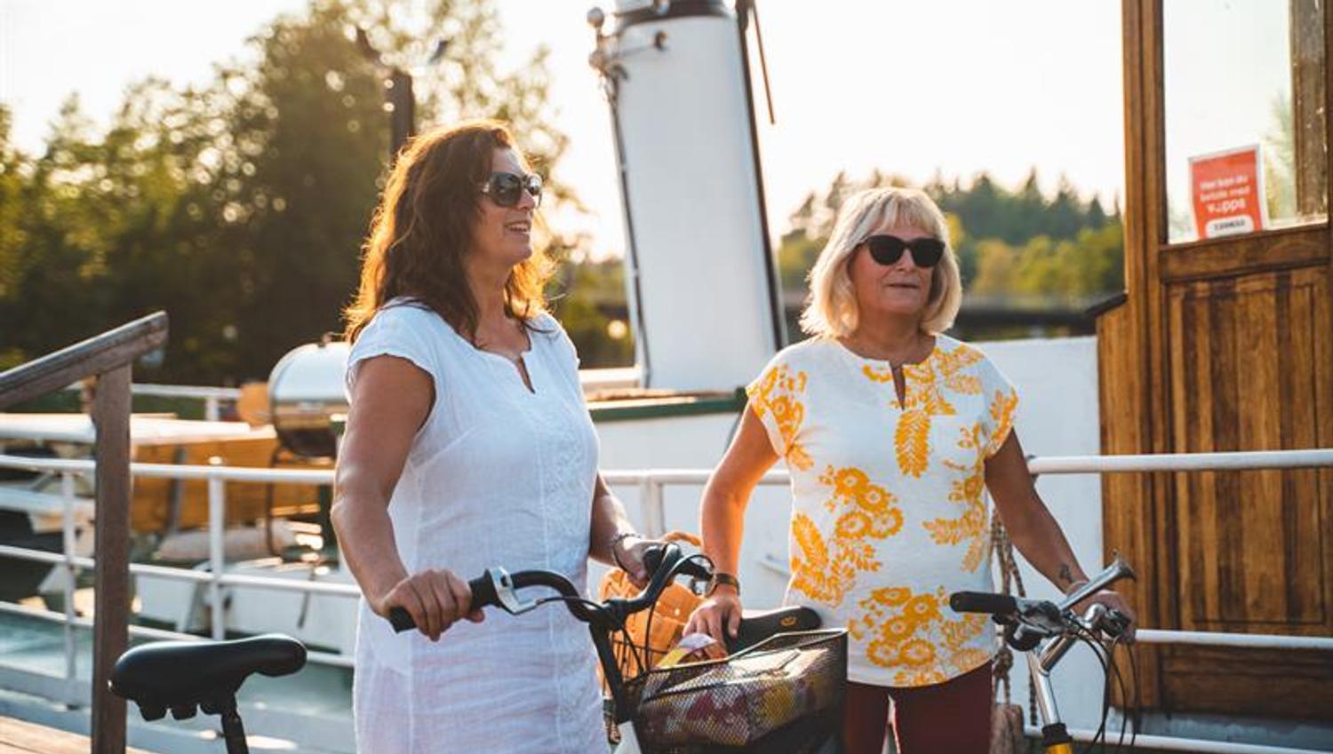 Two women with their bikes
