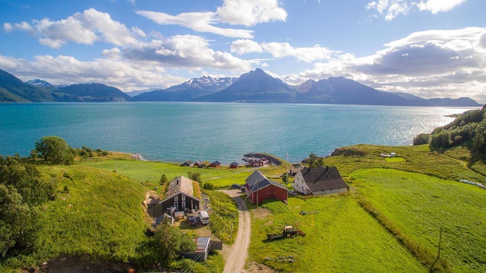 Drone photo view over Dyrøy Holiday, sea and mountains
