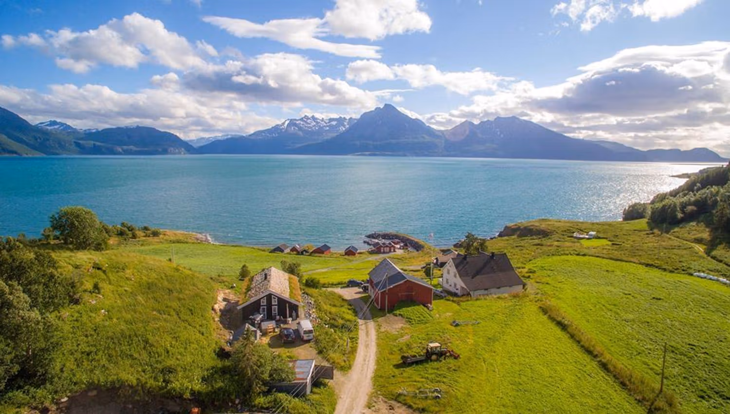 Drone photo view over Dyrøy Holiday, sea and mountains