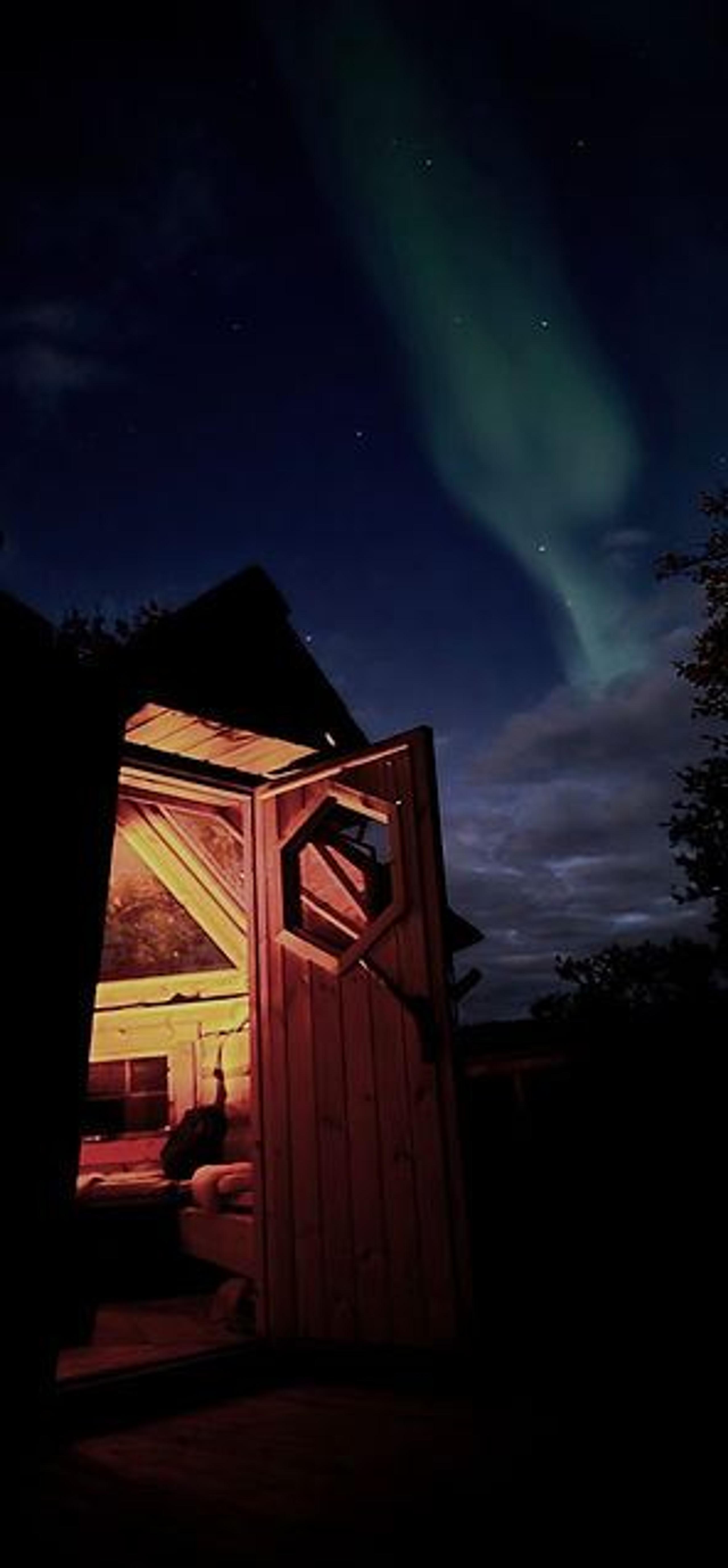 Open cabin and northern lights