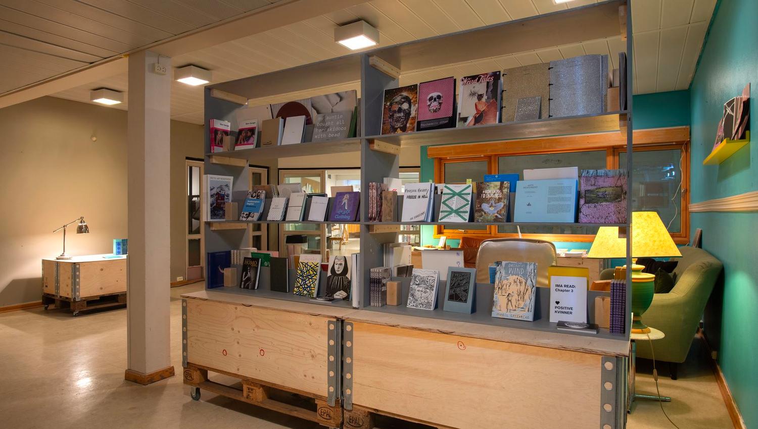 Books on a bookshelf at Tromsø Kunstforening