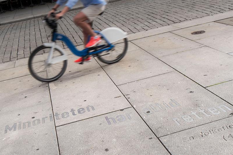 Cyclist cycling by Ibsen quote.