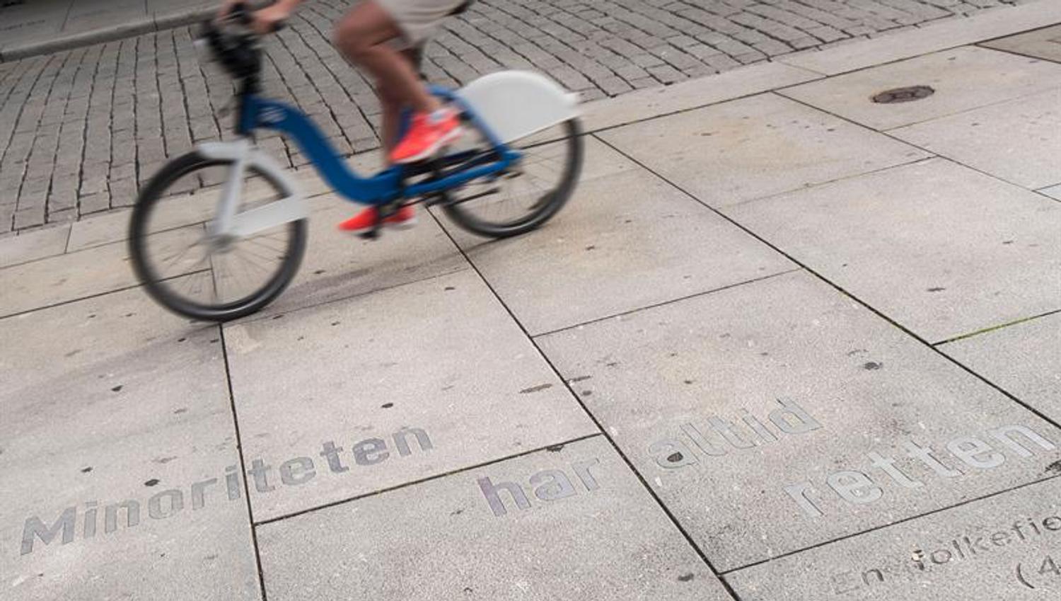 Cyclist cycling by Ibsen quote.