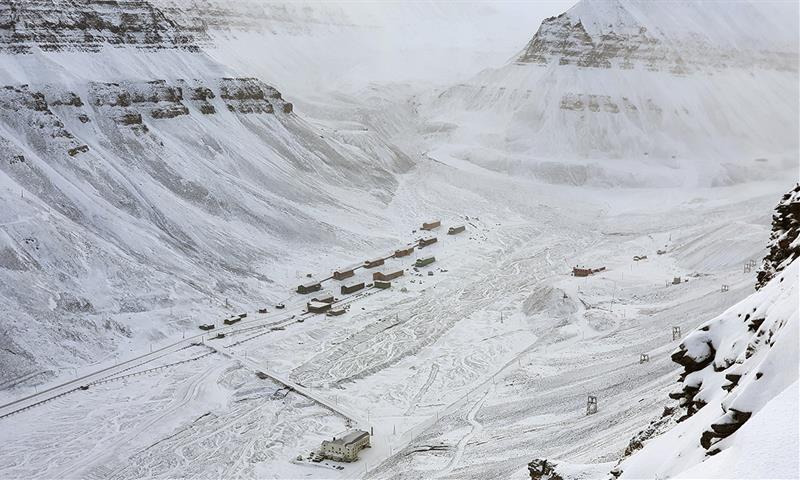 The district called Nybyen in Longyearbyen seen from Platåfjellet with mountains in the background